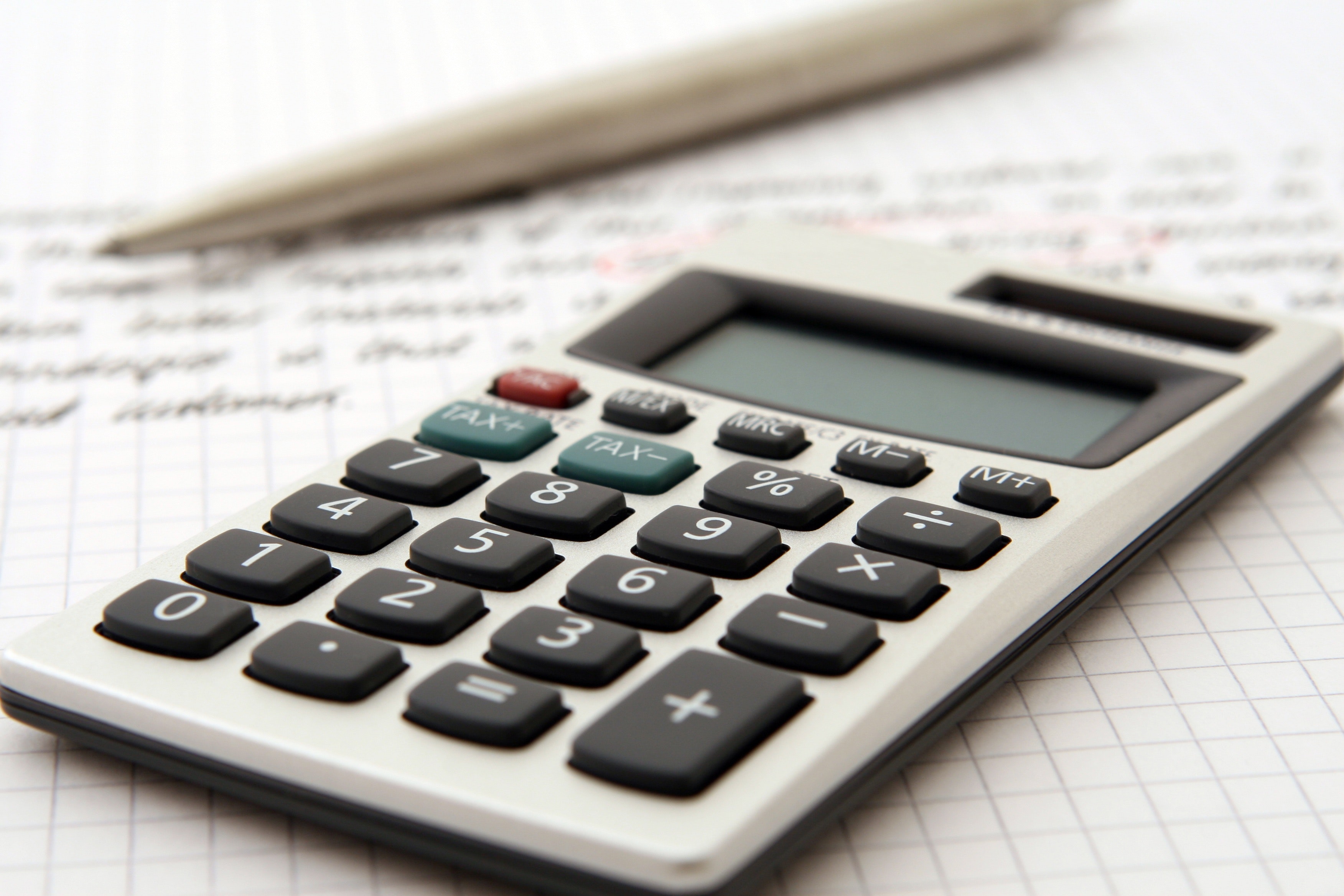 calculator and pencil on balance sheet