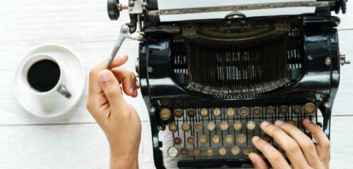 someone typing a letter with a typewriter